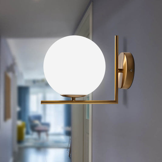 Luxe Brass Globe Wall Light – Elegant Opal Glass for a Timeless Look